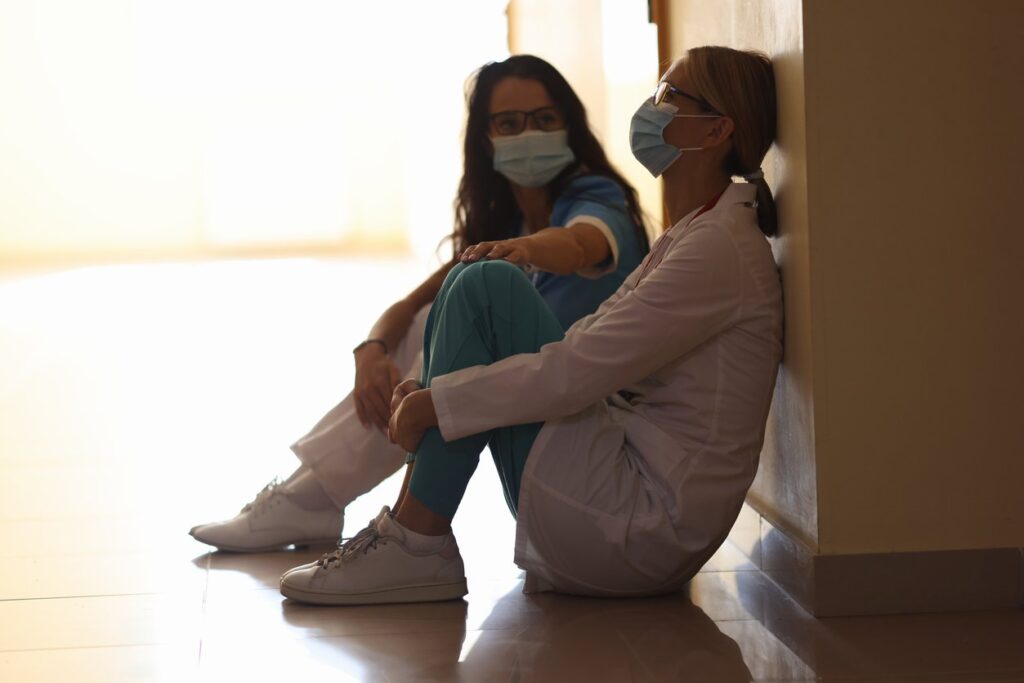hospital workers on floor grief